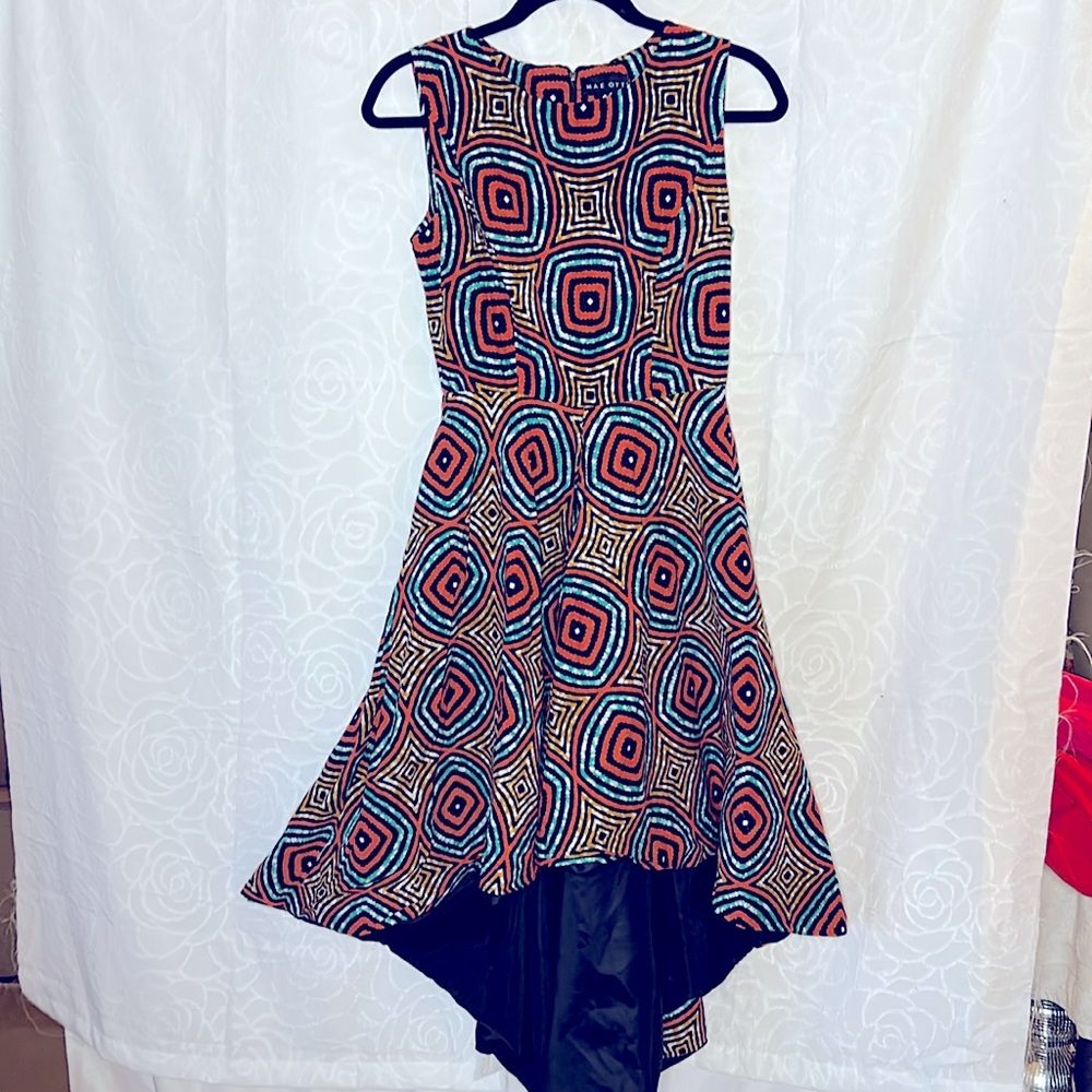MAE OTTI orange, green, black print high low sleeveless dress. Size Small.